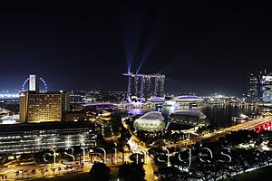 Asia Images Group - Night view of buildings surrounding Marina Bay with lasers off the Sands Casino, Singapore
