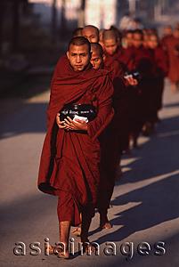Asia Images Group - Myanmar (Burma), Nyaungshwe, Inle lake, Buddhist monks returning to monastery after collecting alms.