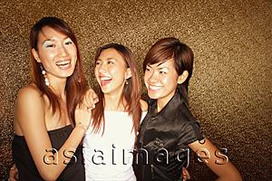 Asia Images Group - Young women arms around each other, smiling