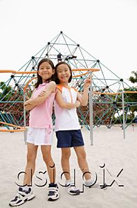 AsiaPix - Girls at playground, standing back to back, smiling at camera