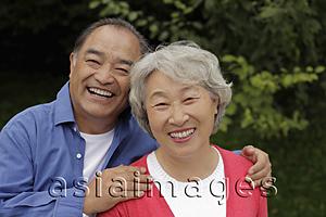 Asia Images Group - Older couple embracing outdoors