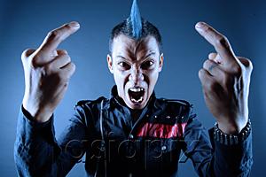 AsiaPix - Man with mohawk, mouth open, making hand sign