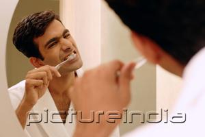 PictureIndia - Man brushing his teeth